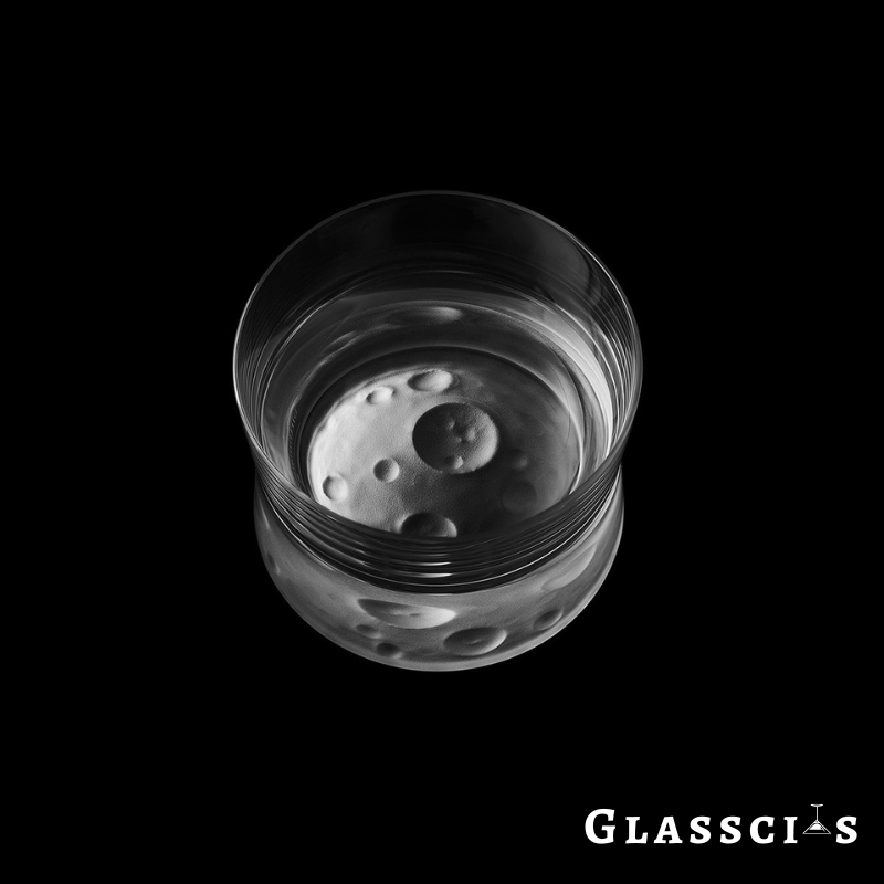 Unique whiskey glass with moon design at the base