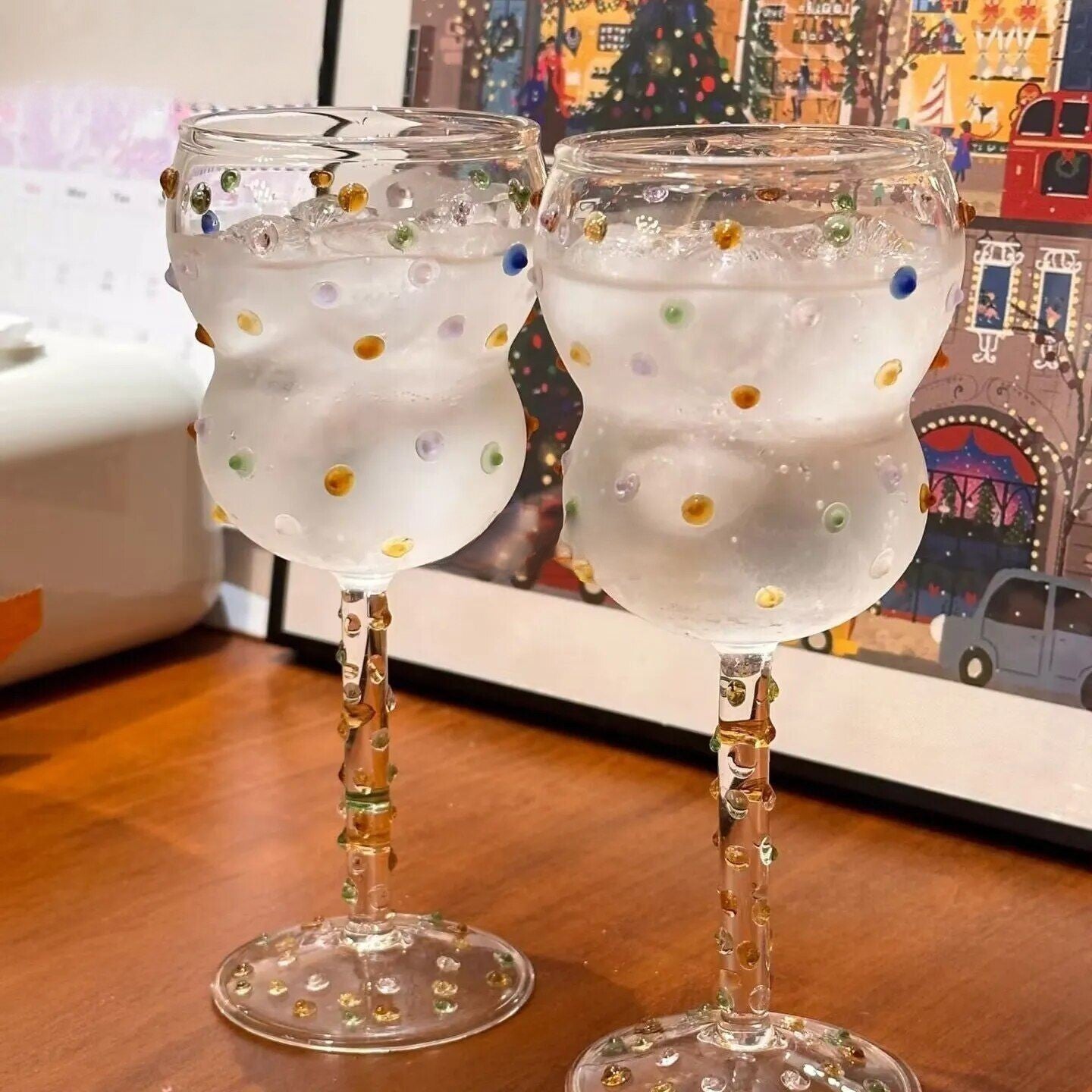 Festive sparkling wine glass with colorful lights decor