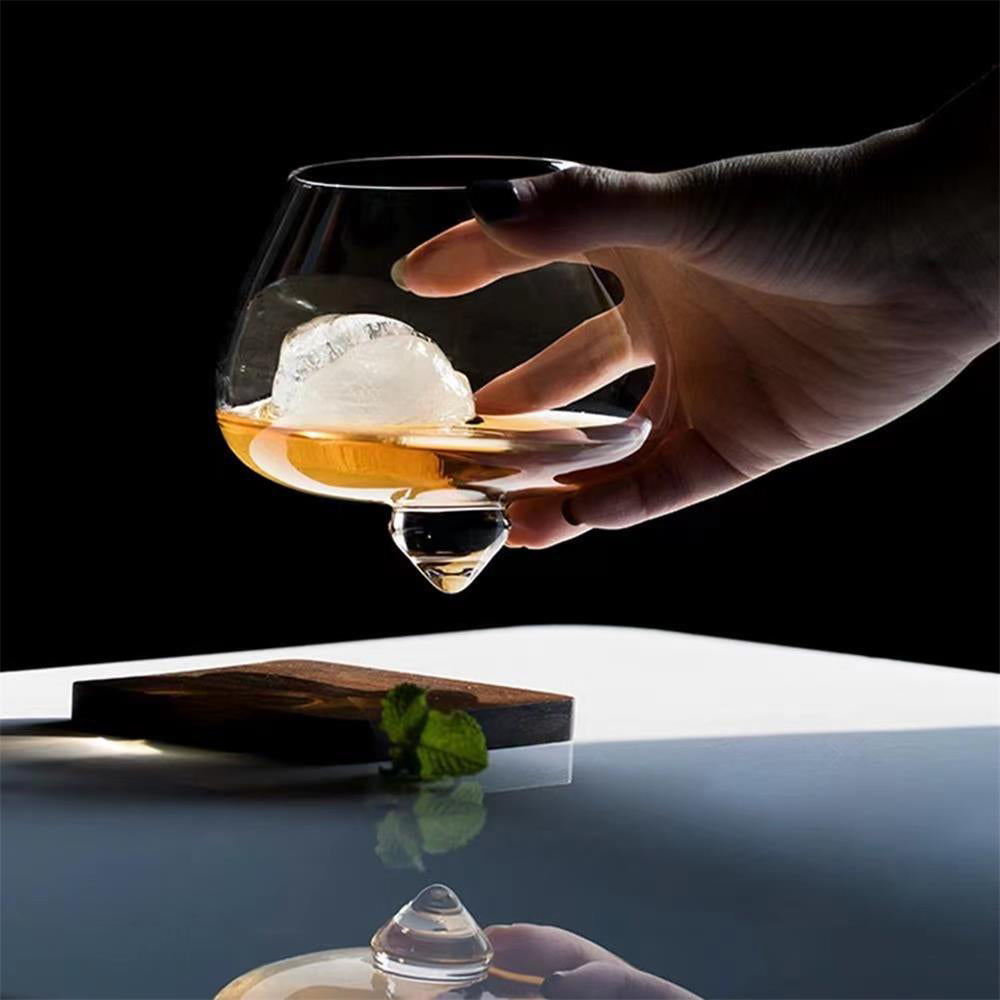Whiskey swirling inside the rotating glass