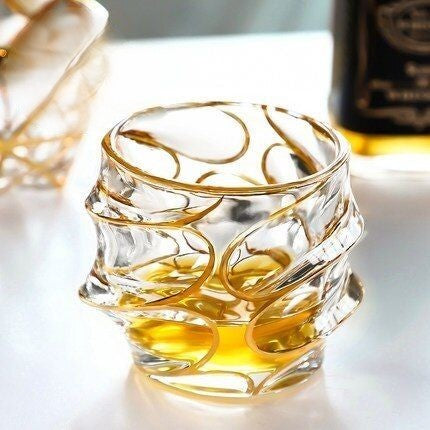 Aesthetic gold doodle design on gold rim old fashioned glasses
