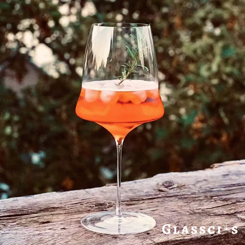 jospehine wine glasses filled with aperol spritz
