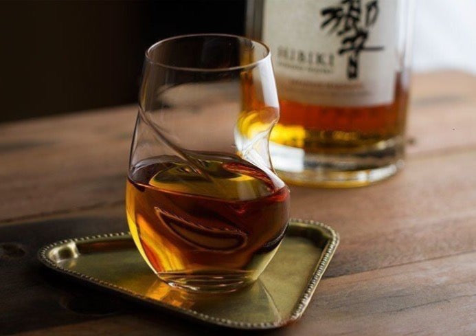 Double helix crumple whiskey glass by glasscias