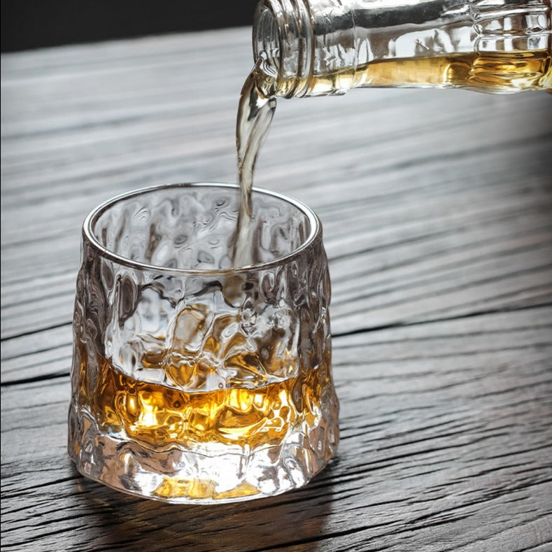 pouring a glass of whiskey into glacier whiskey glass | Glasscias