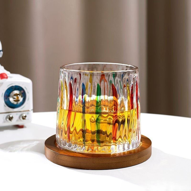 a painted rocking whiskey glass on a coaster