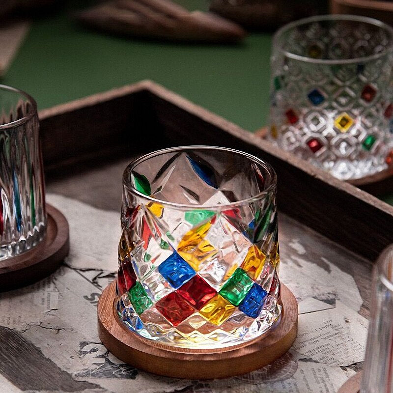 Rocking whiskey glass with diamond cuts