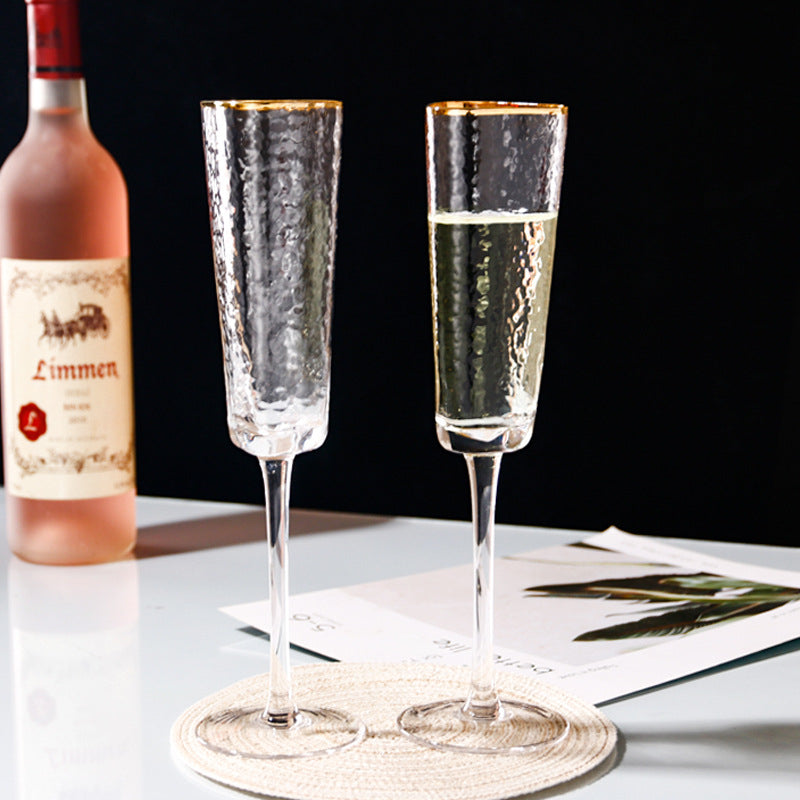 Glasscias' luxurious hammered champagne glass with gold rim