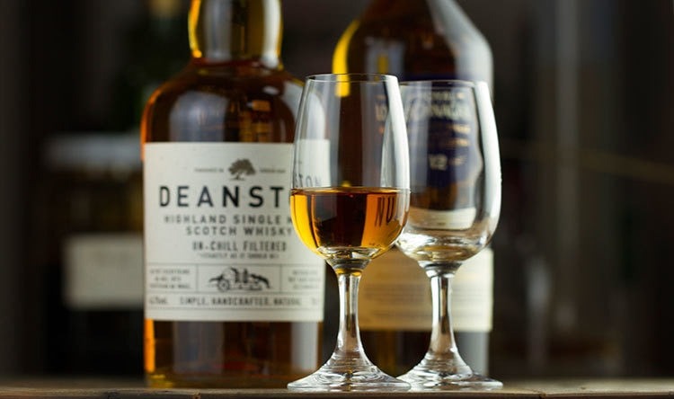a bourbon snifter glass at a fancy bar