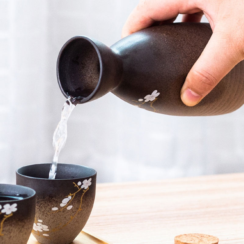 Elegant ceramic sake serving set with cherry blossom motif