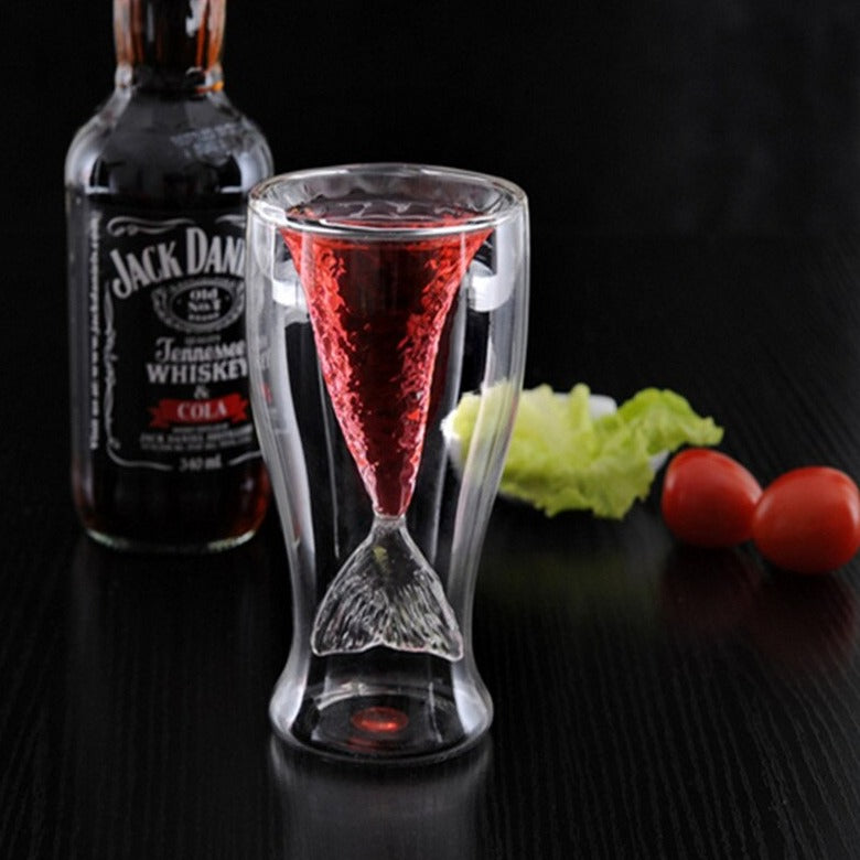 there's a mermaid tail inside double walled cocktail glasses