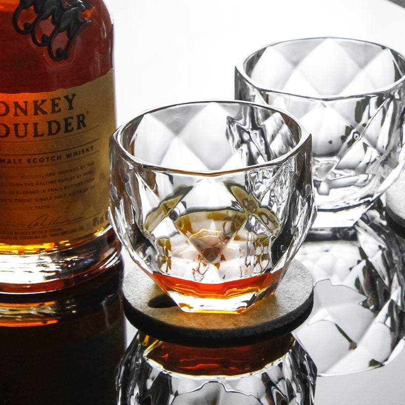 diamond cut rotating whiskey glass by glasscias
