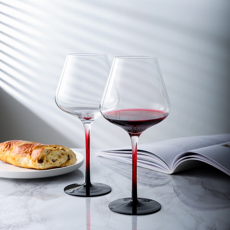 Artisan-crafted wine glass with red stem mystery
