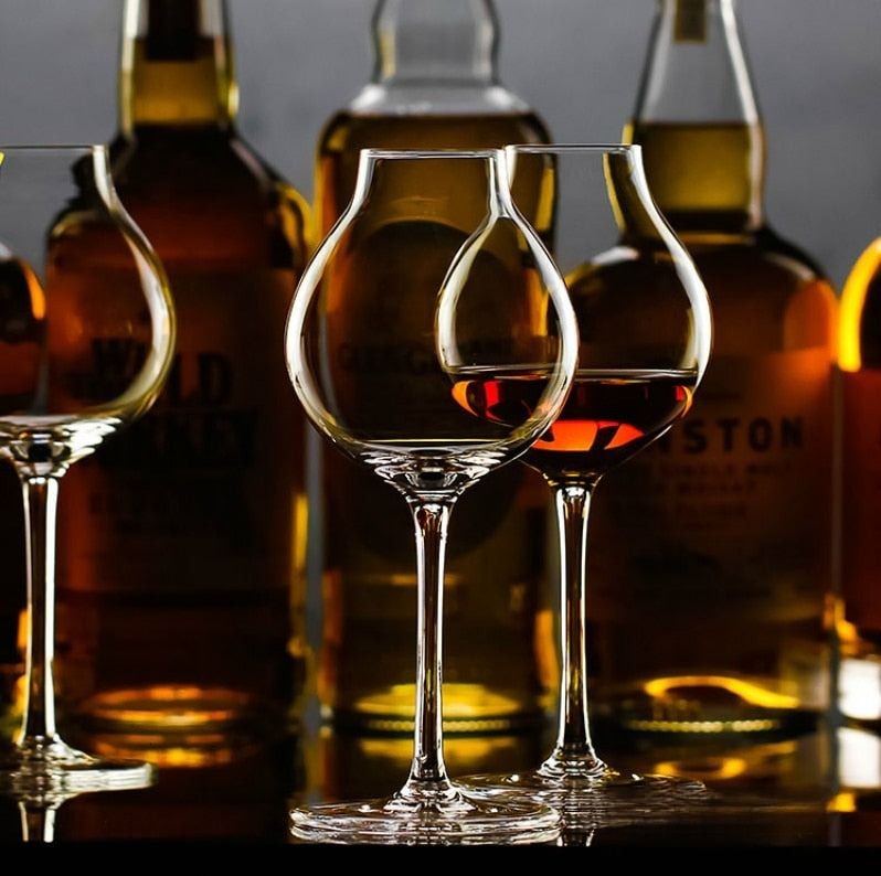 tulip glasses whiskey on a bar