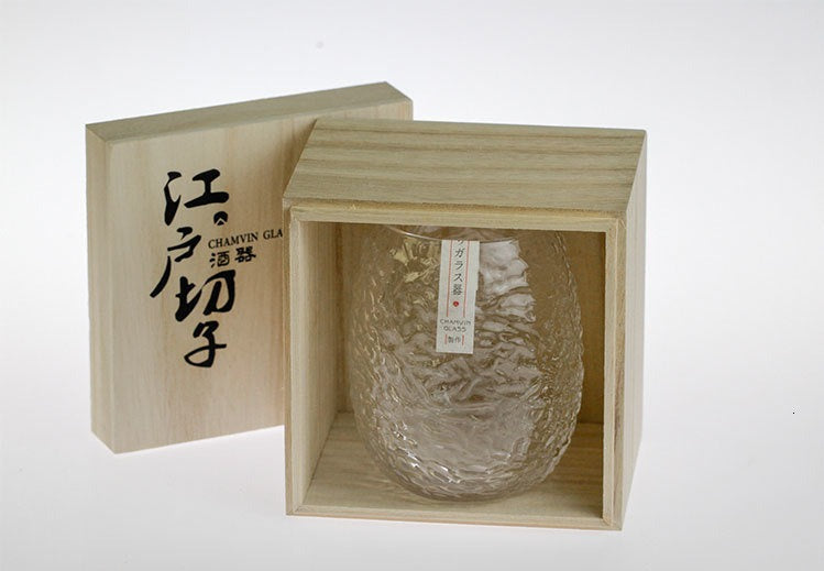 Refined cocoon-inspired whiskey glass with a unique crumpled finish
