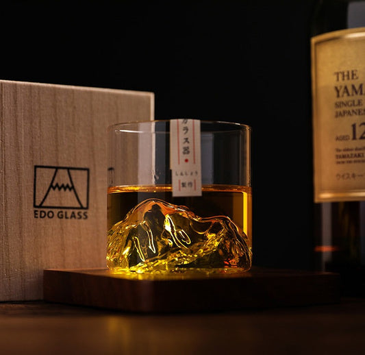 Premium whiskey glass with 3D mountain terrain at the base