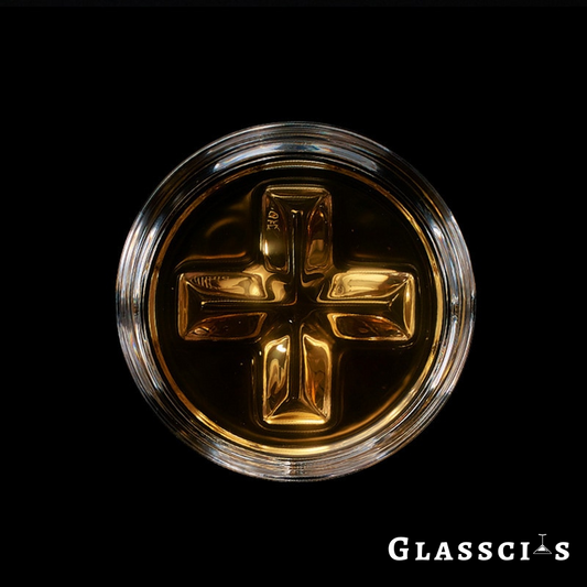 Transparent whiskey glass with 3D cross pattern bottom