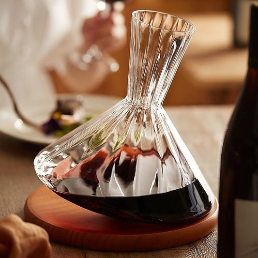 Elegant rotating wine decanter with wood base