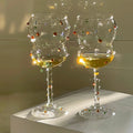 Colorful gem decorated sparkling wine glass
