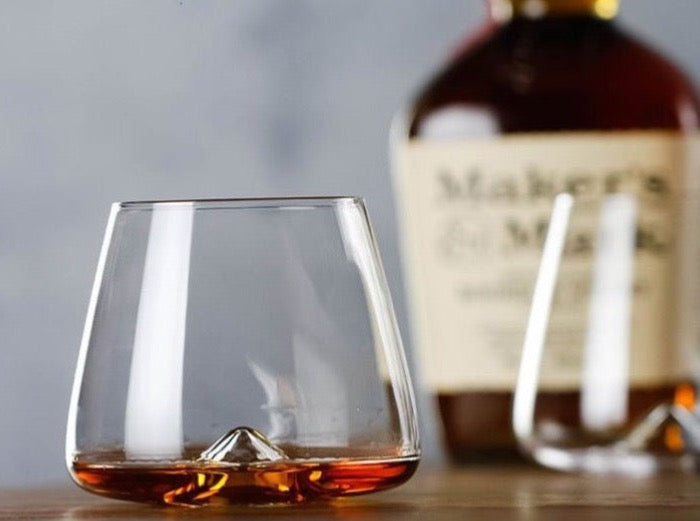 Luxurious hand-made whiskey glass with a standout mountain silhouette at its base