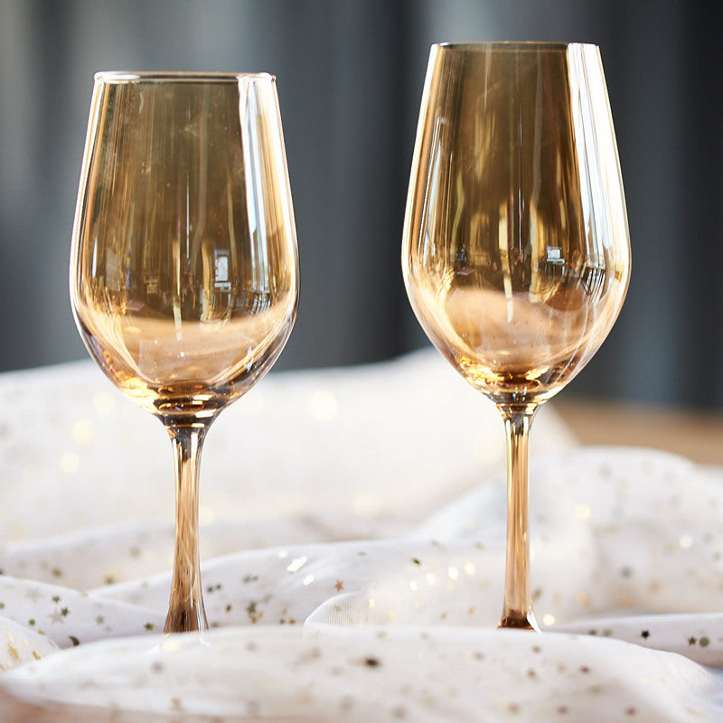 Elegant crystal wine glasses in amber hue