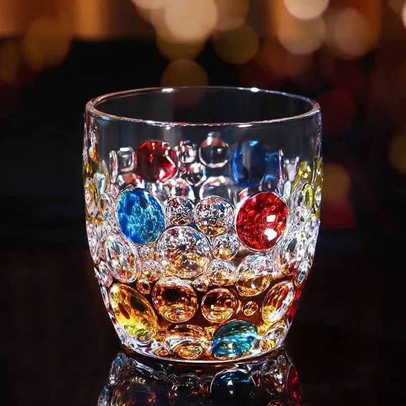Whiskey glasses with red, yellow, and blue dots