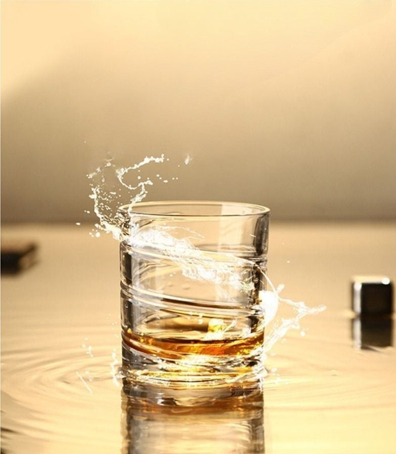 Whiskey glass featuring a continuous swirling design