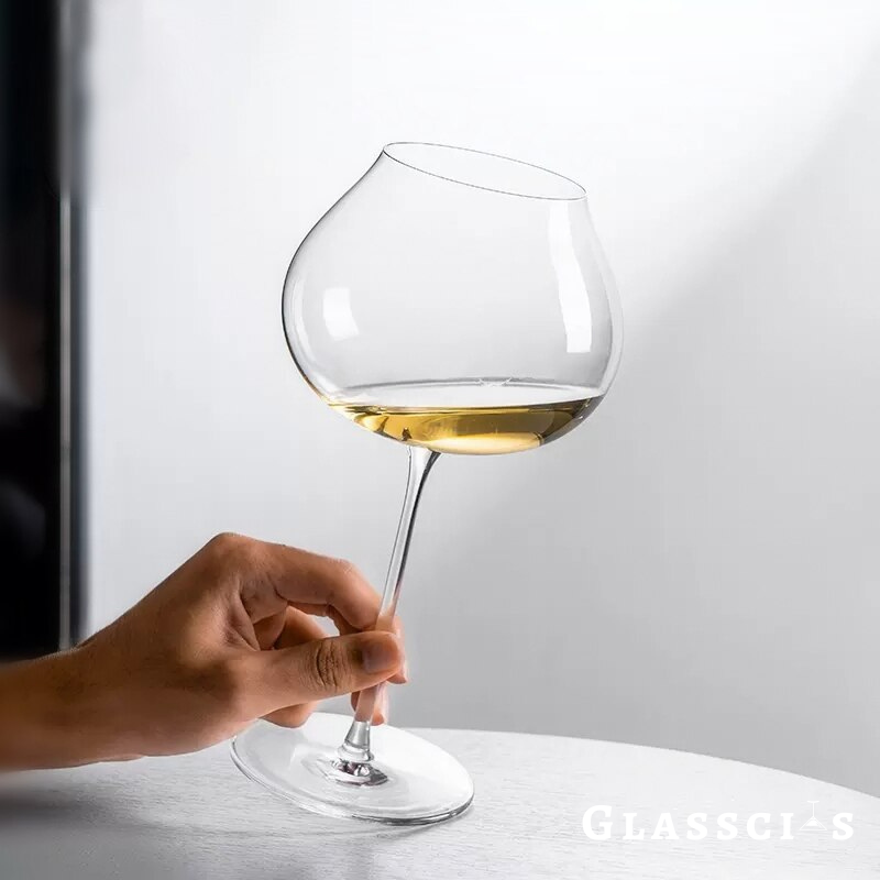 holding a burgundy wine glass