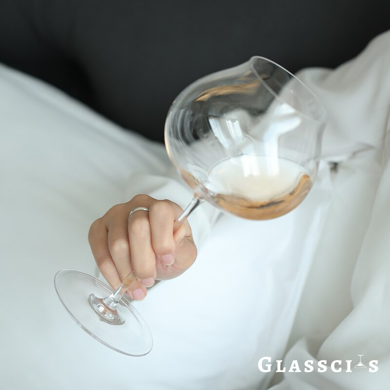 contemporary wine glasses holding by a lady
