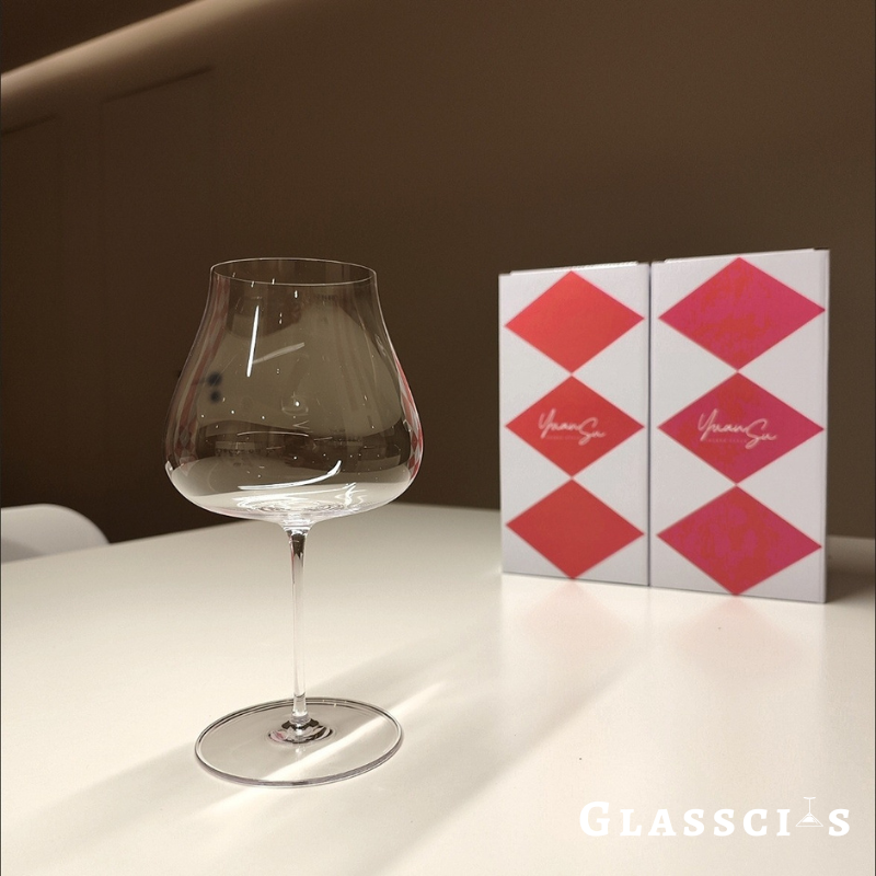 a conterno sensory wine glass on a dining table