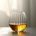 Ribbed whiskey glass with wide base