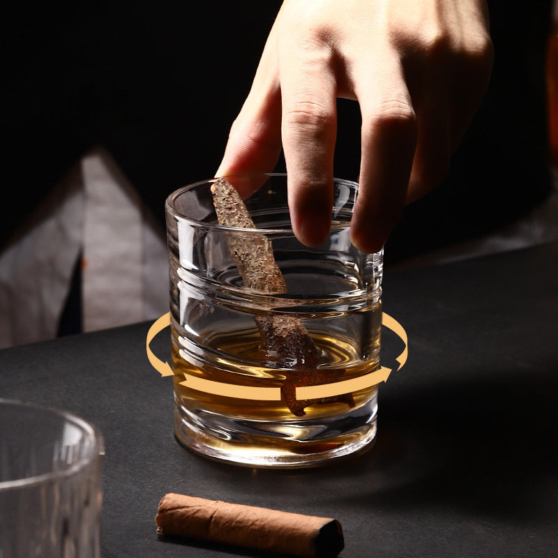 Unique spinning whiskey glass with intricate swirls