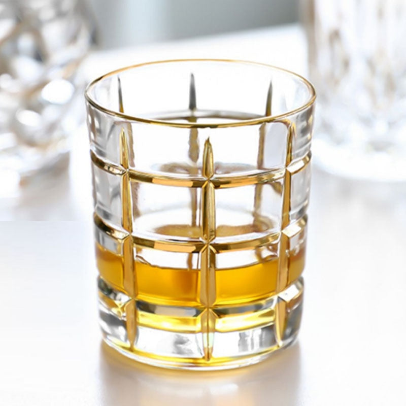 Luxurious gold grid design on whiskey glass