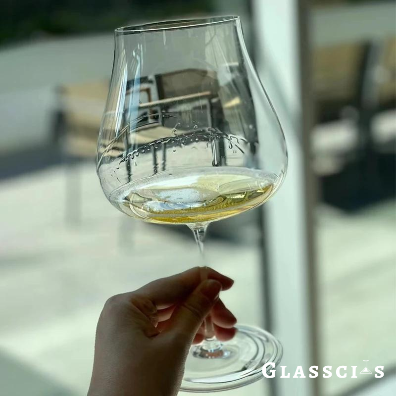 lady swirl white wine in sensory wine glass by giacomo conterno