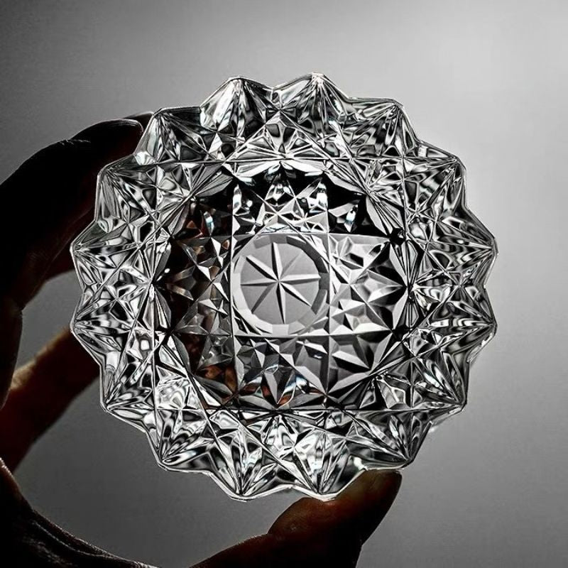 Star-cut base of a crystal whiskey glass, viewed from below
