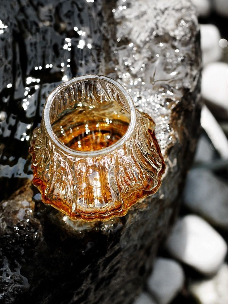 A whiskey glass with volcanic texture, perfect for nature enthusiasts