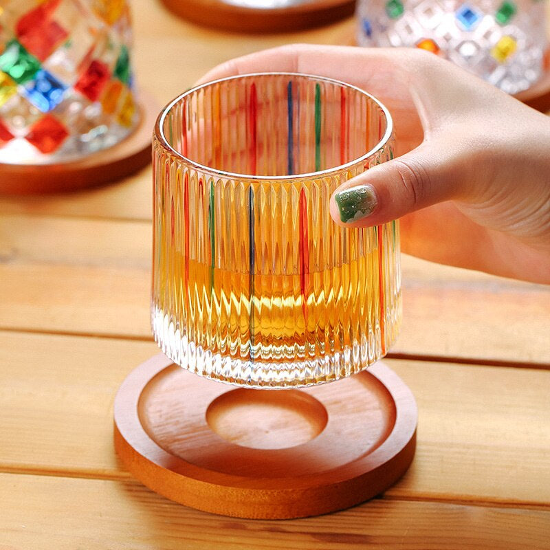 Rocking whiskey glass with colorful stripes design