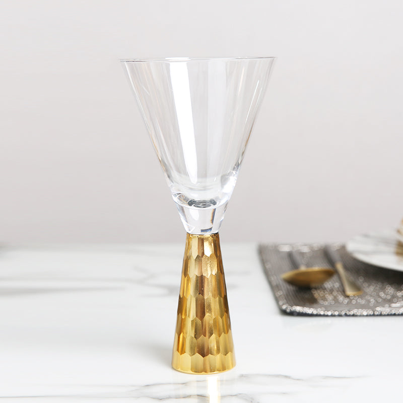 Modern goblet wine glass with a golden base