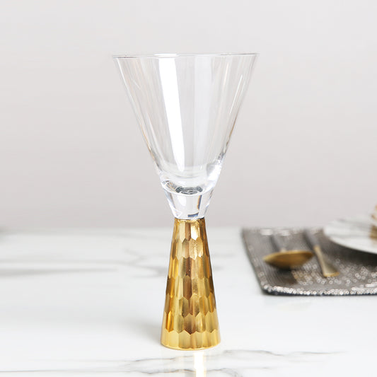 Modern goblet wine glass with a golden base