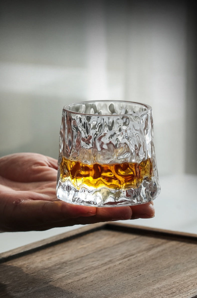 A crystal whiskey glass on hand | Glasscias