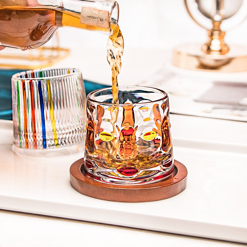 Aesthetic rocking glass adorned with a face design, perfect as both drinkware and decor