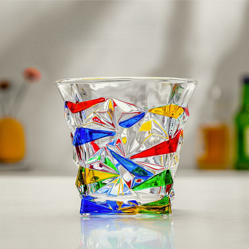 Artistic drinking glass with vibrant crystal patterns