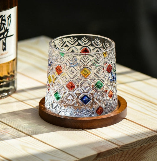 a colorful whiskey glasses on a wooden tableItalian Snowflake Rocking Whiskey Glass Design