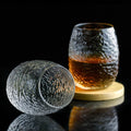 Silk cocoon-shaped whiskey glass with crumpled texture