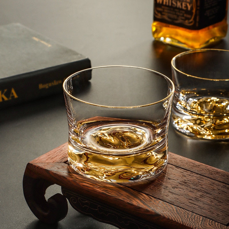 Double-walled glass showcasing mountain peaks inside
