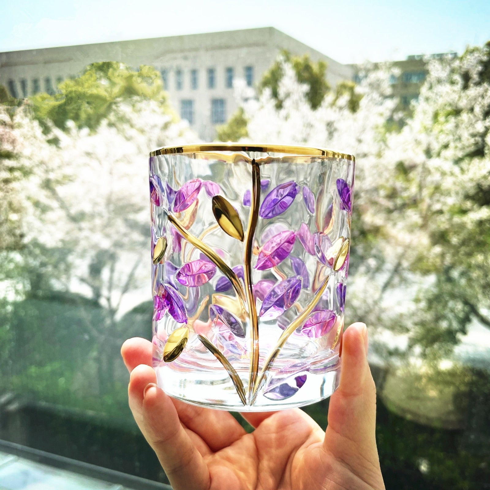 Artistic hand-painted whiskey glass with modern design
