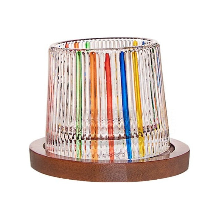 Italian Ribbed Art Glass shimmering with its unique colored patterns, ideal for festive celebrations