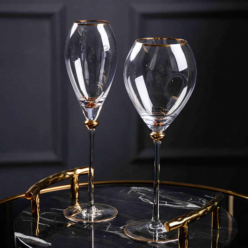 Wine glass with gold rim reflecting opulence