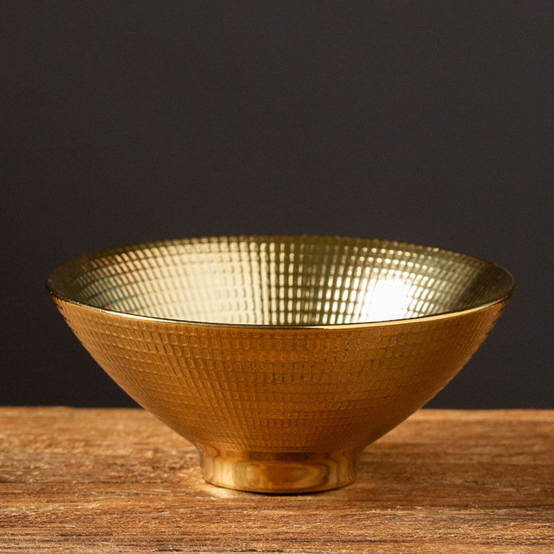Luxurious gold saki cup with shell texture