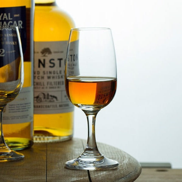 a whiskey tasting glass on a table