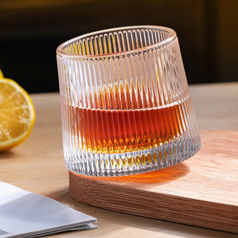a rolling whiskey glasses at a table