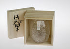 Refined cocoon-inspired whiskey glass with a unique crumpled finish